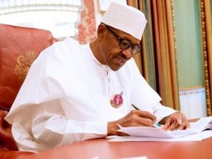 President Buhari signing FUPRE Bill